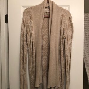 Patterned cream and tan cardigan.